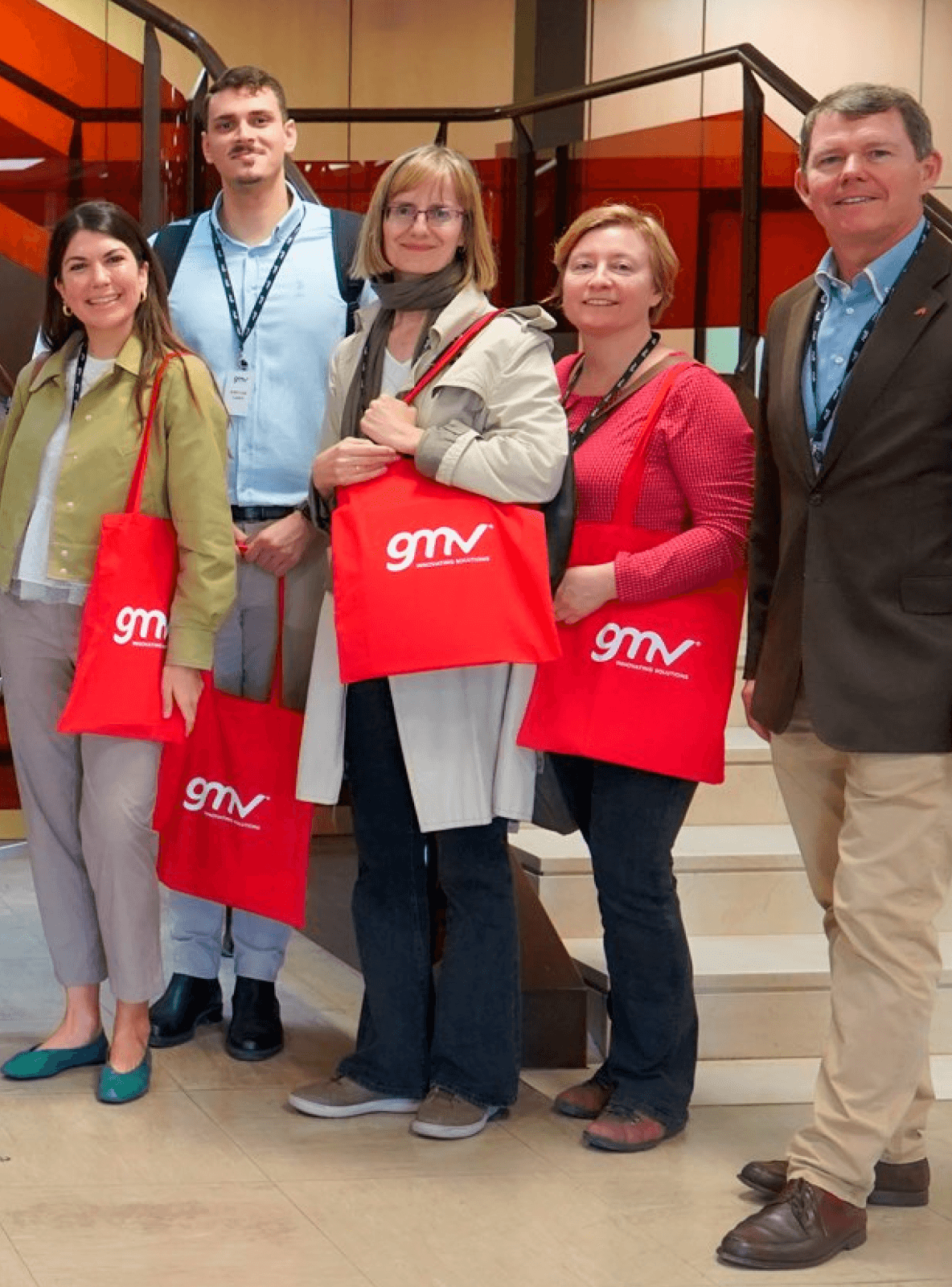 Image of the people holding GMV bags.